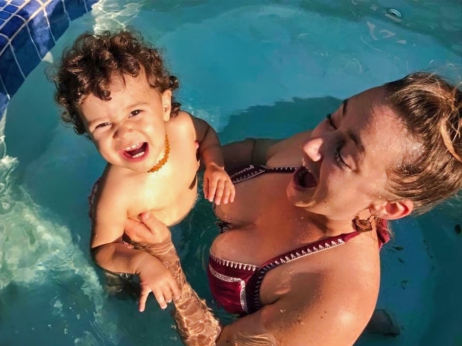 Mama Elisabeth Bolaza and toddler Lyla playing in the pool